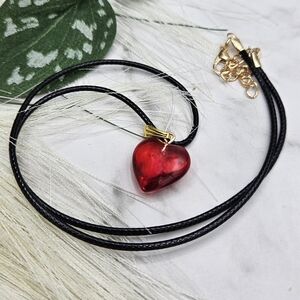 Red puffy heart ❤️ pendant necklace on black cord with gold accents